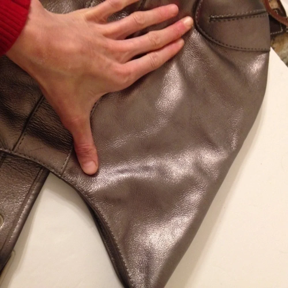 Michael Kors silver metallic hobo bag buckle